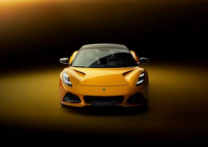 A yellow sports car in a dark room  Description automatically generated with low confidence