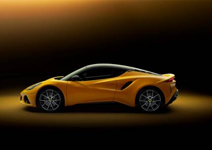 A yellow sports car on a black background  Description automatically generated with medium confidence