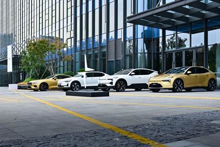 A row of cars parked in front of a building  Description automatically generated