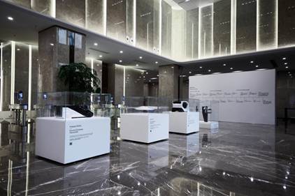 A room with marble flooring and white boxes  Description automatically generated